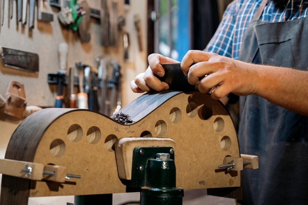 Artisan Making Guitar