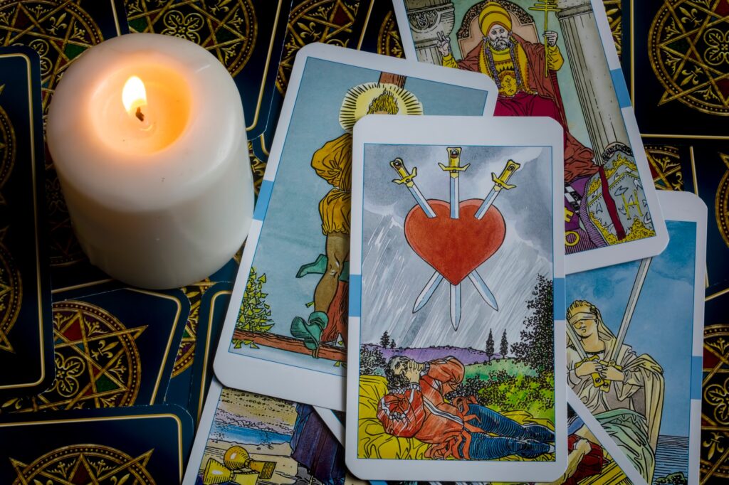 Assorted tarot cards scattered on a table, seamless pattern
