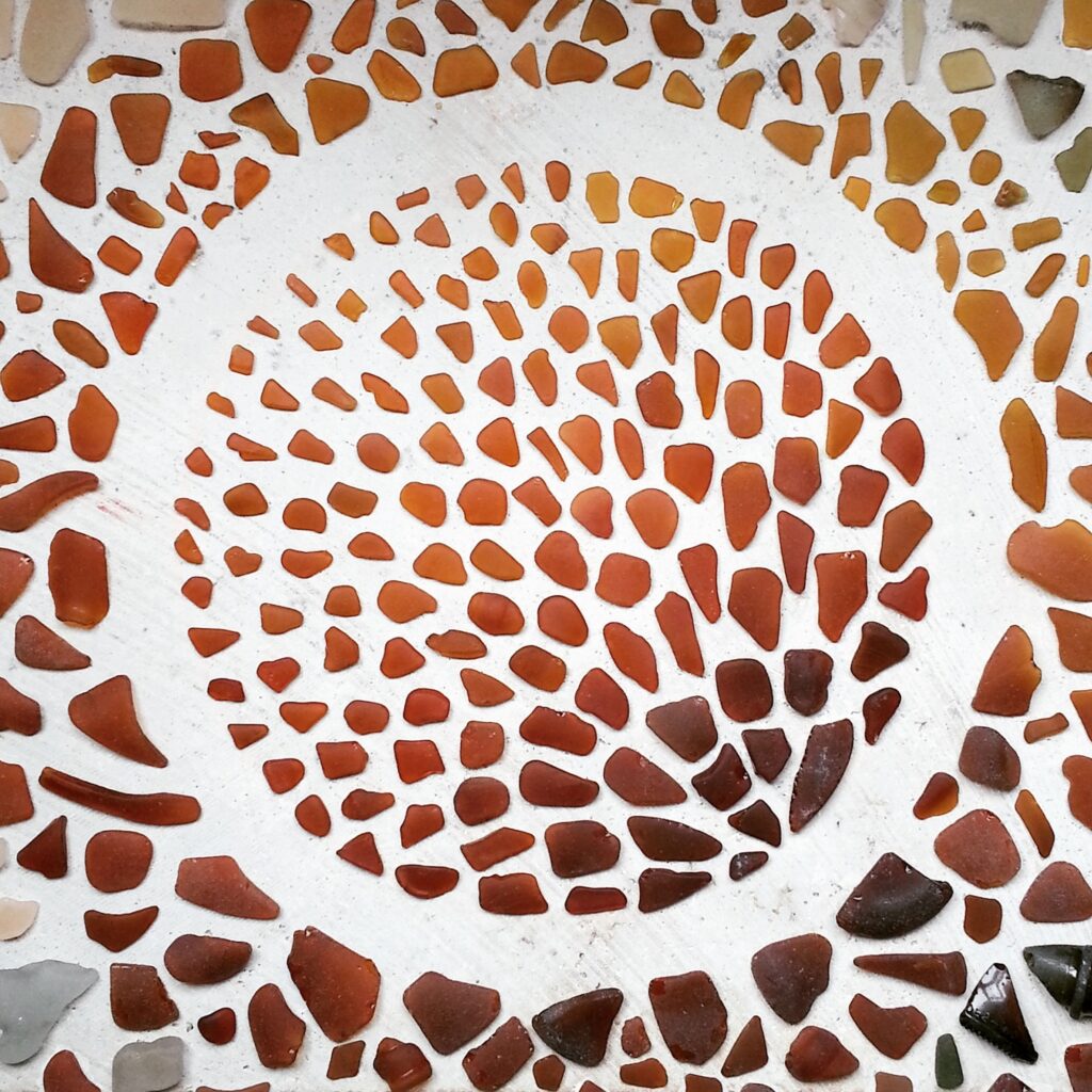 Creative beach art made with recycled glass