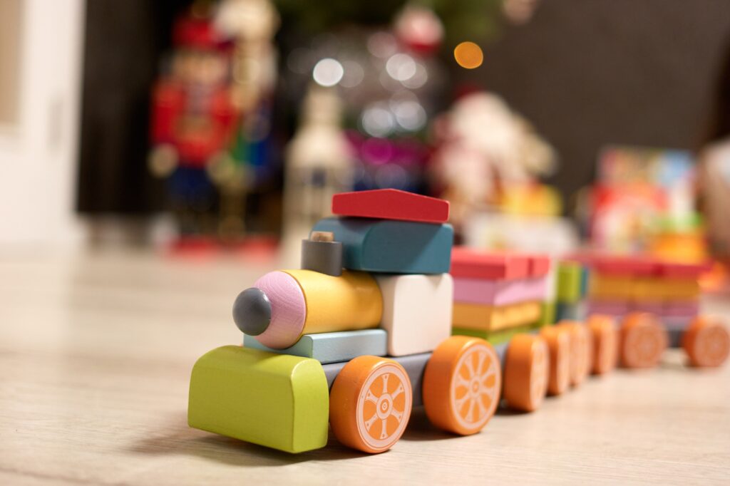 Toy train constructor made of wooden blocks.